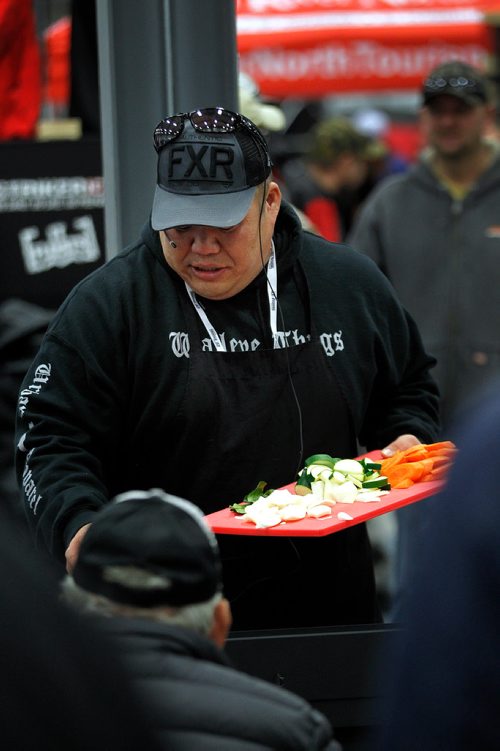 PHIL HOSSACK / WINNIPEG FREE PRESS - Garther Cheung (aka Big China Outdoors) adds the ingredients to his Thai Green Curry Saturday afternoon, Everything from folding fishing shacks to Thai Green Curry Walleye was up for grabs at the first ever Ice Fishing Show Saturday at Red River Exhibition Place. The show continues on through Sunday. - November 17, 2018