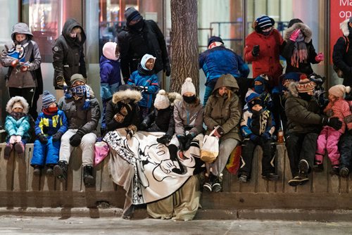 Daniel Crump / Winnipeg Free Press. Despite cold temperatures, and a biting wind, many Winnipeggers still bundled up and lined Portage Avenue for a chance to see Santa. November 17, 2018.