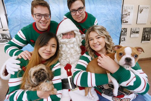 JOHN WOODS / WINNIPEG FREE PRESS
From left, Thao Nguyen and Hazel, Thomas Kinrade, Zane Hinson, and Amy Kinrade and Lily had their photos with Santa Claus, played by Doug Speirs, at Pet Pics with Santa Paws fundraiser in support of the Humane Society at the Winnipeg Free Press Sunday, November 18, 2018.