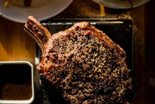 MIKAELA MACKENZIE / WINNIPEG FREE PRESS
A bone-in ribeye steak on a lava rock at Lot 88 in Winnipeg on Friday, Nov. 16, 2018.
Winnipeg Free Press 2018.