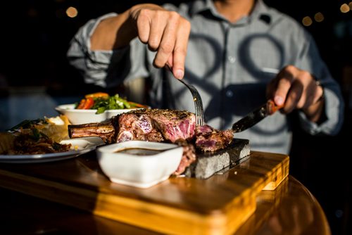 MIKAELA MACKENZIE / WINNIPEG FREE PRESS
The bone-in ribeye steak is seared in the kitchen, then cut into bite-sized pieces by the customer at the table and cooked on the hot lava rock at Lot 88 in Winnipeg on Friday, Nov. 16, 2018.
Winnipeg Free Press 2018.