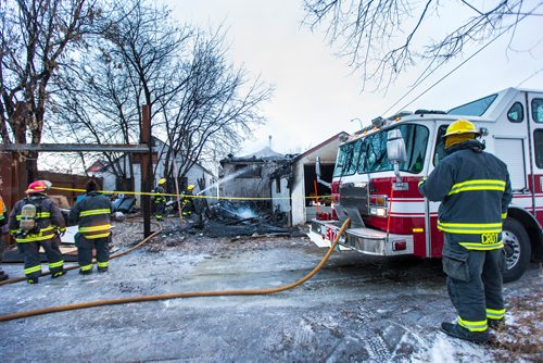 MIKAELA MACKENZIE / WINNIPEG FREE PRESS
Firefighters put out hot spots at a house fire on Selkirk Avenue between Parr and McKenzie in Winnipeg on Tuesday, Nov. 20, 2018.
Winnipeg Free Press 2018.