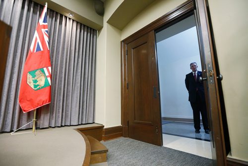 Manitoba premier Brian Pallister waits in a hallway before speaking to media after the reading of the throne speech at  the Manitoba Legislature in Winnipeg, Tuesday, November 20, 2018.   THE CANADIAN PRESS/John Woods