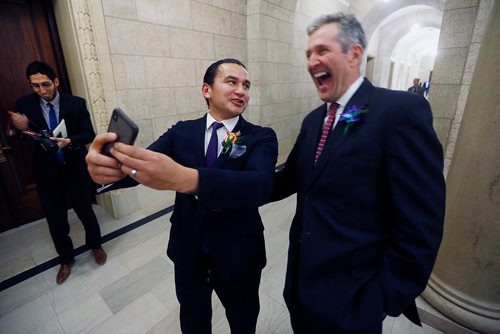 Manitoba premier Brian Pallister, right, and Manitoba opposition leader Wab Kinew pose for a selfie after the reading of the throne speech at  the Manitoba Legislature in Winnipeg, Tuesday, November 20, 2018.   THE CANADIAN PRESS/John Woods
