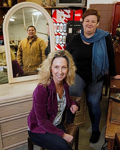 PHIL HOSSACK / WINNIPEG FREE PRESS - SCCOPE. EXEC. DIRECTOR ANGELA MCCAUGHAN (FRONT) AND MONICA SCHROEDER (RIGHT) POSE WITH A REFLECTION OF EVAN FONTAINE WHO SSCOPE HELPS OUT. EVAN DOES WORK AROUND THE THRIFT STORE AND MORE.   - November 21, 2018