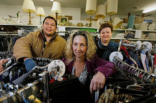 PHIL HOSSACK / WINNIPEG FREE PRESS - Evan Fontaine (left) and Monica SDchroeder (right) pose with SCCOPE.Executive Director Angela McCaughan in the centre's Arlington ave Thrift Store.  See Kevin Rollason's story.  - November 21, 2018