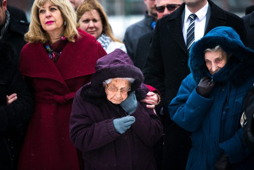 MIKAELA MACKENZIE / WINNIPEG FREE PRESS
Survivor Maria Zajcew (centre) holds her hood closed against the cold wind as people gather to commemorate the 85th anniversary of the end of the Holodomor, a famine genocide that claimed millions of lives in Ukraine between 1932 and 1933, at the Manitoba Legislative Building in Winnipeg on Thursday, Nov. 22, 2018.
Winnipeg Free Press 2018.