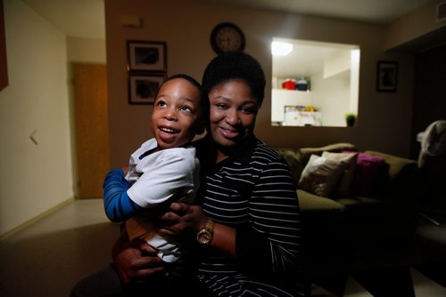 PHIL HOSSACK / WINNIPEG FREE PRESS - Olubukola Omoruku (this is the correct spelling, Bill asked me to check) and her 4 year old son Ethan sit for the camera Thursday evening. See Redekop story re: United Way - November 22, 2018