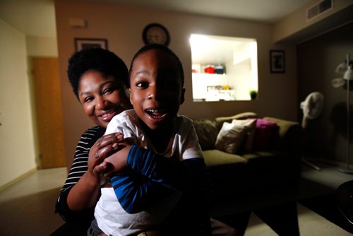 PHIL HOSSACK / WINNIPEG FREE PRESS - Olubukola Omoruku (this is the correct spelling, Bill asked me to check) and her 4 year old son Ethan sit for the camera Thursday evening. See Redekop story re: United Way - November 22, 2018