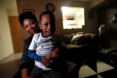 PHIL HOSSACK / WINNIPEG FREE PRESS - Olubukola Omoruku (this is the correct spelling, Bill asked me to check) and her 4 year old son Ethan sit for the camera Thursday evening. See Redekop story re: United Way - November 22, 2018