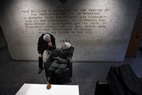 PHIL HOSSACK / WINNIPEG FREE PRESS - Sitting in front of another fitting memorial, 83 yr old Zena Dlugosh speaks with her son Wolodymyr inside the foyer at City Hall as members of Winnipeg's Ukrainian Community gather Saturday to mark Ukrainian Famine and Genocide (Holodomor) Memorial Day. Born immediately after the famine family memories are still clear in Zena's mind.  Alex Paul story. - November 24, 2018