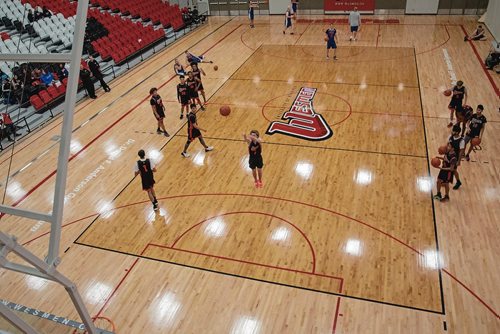 Canstar Community News Nov. 19 - The University of Winnipeg Collegiate varsity boys basketball team took on the Winnipeg Police Service team in a charity match to raise funds for the Bruce Oake Recovery Centre. (EVA WASNEY/CANSTAR COMMUNITY NEWS/METRO)