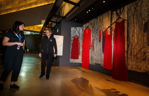 MIKE DEAL / WINNIPEG FREE PRESS
Gov. Gen. Julie Payette tours the CMHR Tuesday morning with Brigitte Savard, an assistant manager at the CMHR. 
The exhibit, called From Sorrow to Strength, is about missing and murdered Indigenous women and girls. Its centrepiece is The REDress Project,  an art installation by Winnipeg artist Jaime Black, consisting of empty, blood-red dresses hanging in front of a woodland background -- a statement about racism, sexism and marginalization of Indigenous women in Canada.
181127 - Tuesday, November 27, 2018.
