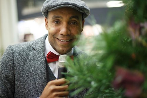 MIKE DEAL / WINNIPEG FREE PRESS
Chad Celaire, in front of the huge tree in Cityplace shopping centre, has for the last three holiday seasons rented out his vocal services, billing himself as The Christmas Singer.
181127 - Tuesday, November 27, 2018.