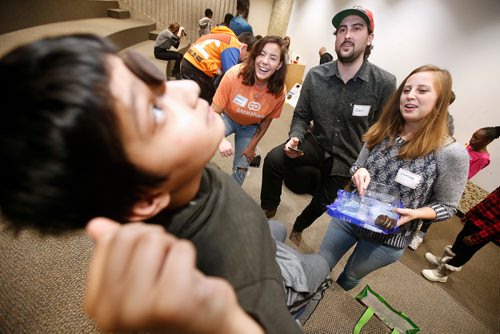 JOHN WOODS / WINNIPEG FREE PRESS
Chantal Lacoste, Mealshare Winnipeg Community Leader, from left, Quin Cook, chef at Smith, and Carolina Konard, owner of Clementine, cheer on Rohan as he attempts to balance a cookie at a Boys and Girls Club event at Dalhousie School Tuesday, November 27, 2018. In the Boys and Girls Club's Mealshare program partnering local restaurants provide funds from their selected Mealshare menu items to local charities to provide meals to youth in need.