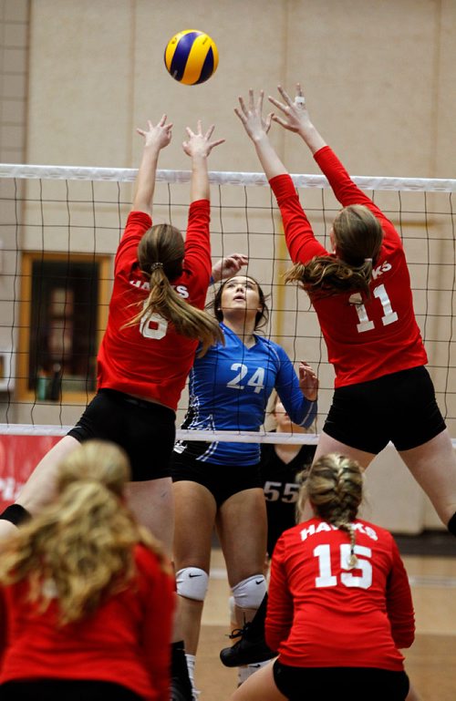 PHIL HOSSACK / WINNIPEG FREE PRESS -Jeanne-Sauve Olympiens #24 Liberty Alford watches her shot clear MBCI blockers #6Mia Hildebrandt and #11Anna Rogalsky. - November 28, 2018