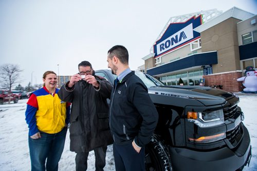 MIKAELA MACKENZIE / WINNIPEG FREE PRESS
Tammy Kondryshyn, Rona store manager (left) and Devin Cuscito, Vickar Community Chevrolet sales manager, hand winner John Shantz the keys to his new Chevrolet Silverado in Winnipeg on Thursday, Nov. 29, 2018. Shantz, a contractor, won the Three Chevrolet Silverado Giveaway Contest with a purchase of $100 or more.
Winnipeg Free Press 2018.