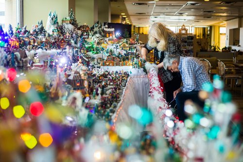 MIKAELA MACKENZIE / WINNIPEG FREE PRESS
Brian and Terry Vanoutrive add a light to the Christmas village that they build every year at their residence, Fred Douglas Place, in Winnipeg on Friday, Nov. 23, 2018.
Winnipeg Free Press 2018.