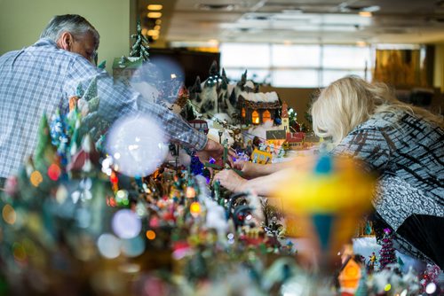 MIKAELA MACKENZIE / WINNIPEG FREE PRESS
Brian and Terry Vanoutrive add a light to the Christmas village that they build every year at their residence, Fred Douglas Place, in Winnipeg on Friday, Nov. 23, 2018.
Winnipeg Free Press 2018.