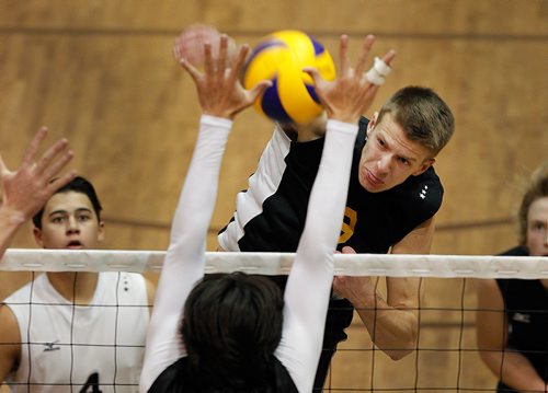 PHIL HOSSACK / WINNIPEG FREE PRESS - Steinbach Sabre #12 Trayton Lepp hits Dakota Lancer #4 Justin Stecher's hands in playoff action Thursday evening.  - November 29, 2018