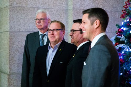 MIKAELA MACKENZIE / WINNIPEG FREE PRESS
President of the Association of Manitoba Municipalities Ralph Groening (left), Finance Minister Scott Fielding, Municipal Relations Minister Jeff Wharton, and Mayor Brian Bowman pose for a group picture after a press conference about new provisions facilitating the disclosure and investigation of serious wrongdoing within public-sector entities at the Manitoba Legislative Building in Winnipeg on Friday, Nov. 30, 2018.
Winnipeg Free Press 2018.