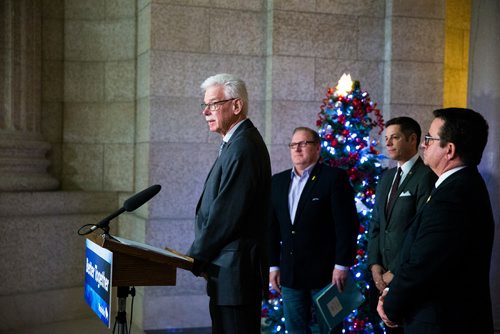 MIKAELA MACKENZIE / WINNIPEG FREE PRESS
President of the Association of Manitoba Municipalities Ralph Groening speaks with Finance Minister Scott Fielding (left), Mayor Brian Bowman, and Municipal Relations Minister Jeff Wharton behind him at a press conferenceabout new provisions facilitating the disclosure and investigation of serious wrongdoing within public-sector entities at the Manitoba Legislative Building in Winnipeg on Friday, Nov. 30, 2018.
Winnipeg Free Press 2018.