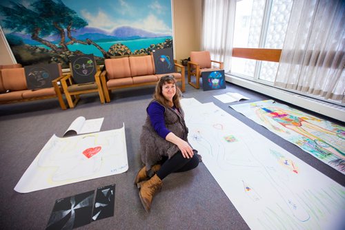 MIKAELA MACKENZIE / WINNIPEG FREE PRESS
Miriam Duff, a psychosocial oncology clinician who runs a weekly Expressive Arts Group, poses with art made by students at CancerCare Manitoba  in Winnipeg on Friday, Nov. 30, 2018.
Winnipeg Free Press 2018.