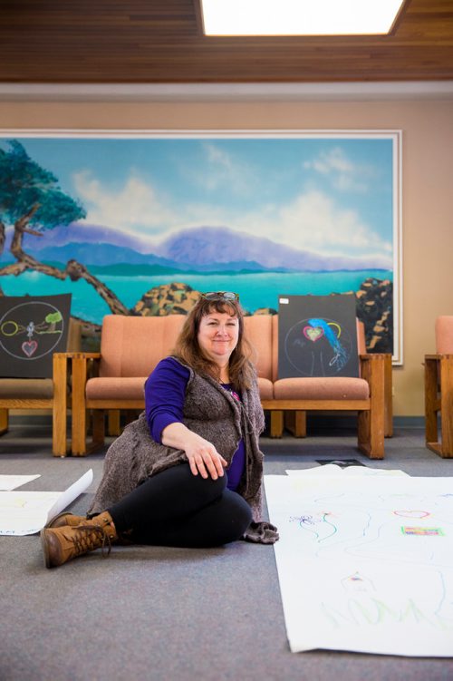MIKAELA MACKENZIE / WINNIPEG FREE PRESS
Miriam Duff, a psychosocial oncology clinician who runs a weekly Expressive Arts Group, poses with art made by students at CancerCare Manitoba  in Winnipeg on Friday, Nov. 30, 2018.
Winnipeg Free Press 2018.
