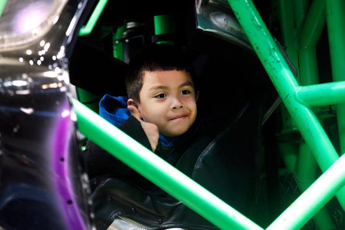 PHIL HOSSACK / WINNIPEG FREE PRESS - 8 Yr old Kaysin Green settles in to the cockpit of a monster truck Friday afternoon at Bell/MTS Place. He and his siblings were guests at Monster Jam's event for the "Dream Factory". See release.  - November 30, 2018