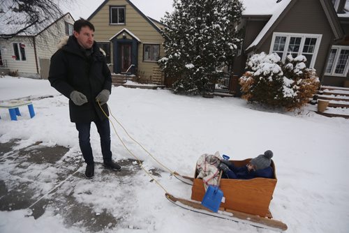 TREVOR HAGAN / WINNIPEG FREE PRESS
Wayne Doerksen pulls his son, Beau, 3, in a sled, Saturday, December 1, 2018.