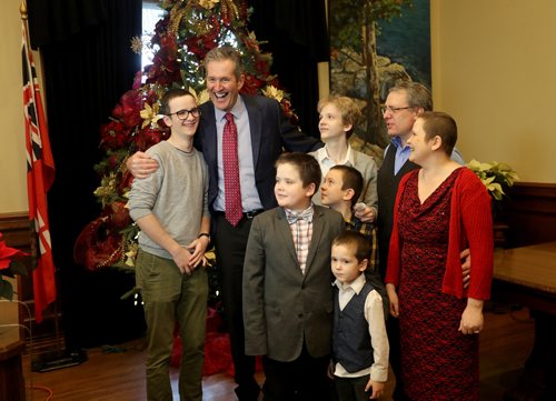 TREVOR HAGAN / WINNIPEG FREE PRESS
Premier Brian Pallister with, from left, Joshua, 17, Joseph, 11, Josiah, 16, Jonathan, 9, Jathan, 5, Jerome and Angela Dondo at the annual open house at the Manitoba Legislative Building, Saturday, December 1, 2018. Angela came to thank the premier for her ability to receive cancer treatments in the US.