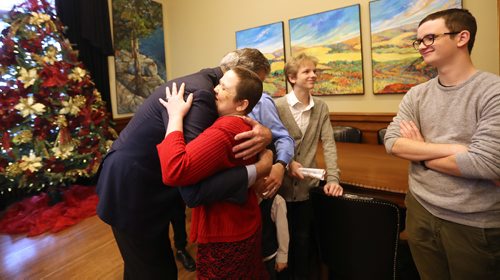 TREVOR HAGAN / WINNIPEG FREE PRESS
Premier Brian Pallister hugging Angela Dondo, as her sons, Josiah, 16, and Joshua, 17, look on, at the annual open house at the Manitoba Legislative Building, Saturday, December 1, 2018. Angela thanked the premier for her ability to receive cancer treatments in the US.