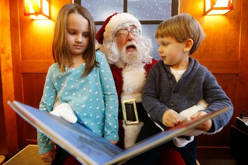 JOHN WOODS / WINNIPEG FREE PRESS
Santa, played by Ron Robinson, reads stories to Sara and George Canelada at McNally Robinson Bookstore Sunday, December 2, 2018.