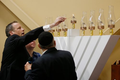 JOHN WOODS / WINNIPEG FREE PRESS
John Orlikow lights a menorah for Chanukah at Chabad Lubavitch Sunday, December 2, 2018.