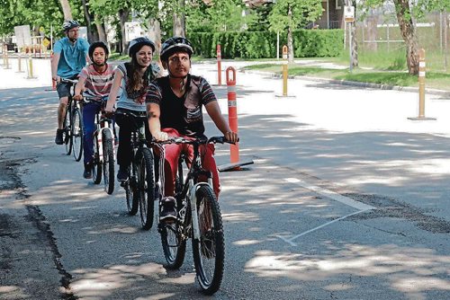 Canstar Community News June 20, 2017 - People try out the pop-up protected bike lanes on Bannatyne Avenue in front of Hugh John MacDonald School. (LIGIA BRAIDOTTI/CANSTAR COMMUNITY NEWS/TIMES)