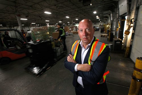 PHIL HOSSACK / WINNIPEG FREE PRESS - Darin Downey, President of Gardewine Trucking poses in their Eagle Dr. warehouse where trucks headed north are loaded with cargo. See Martin Cash story. - DECEMBER 3, 2018