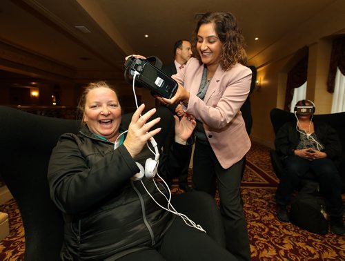 JASON HALSTEAD / WINNIPEG FREE PRESS

L-R: Becky Bonertz (left) tries out EMD Serono's virtual-reality 'MS Inside Out' simulator with help from Smita Devane-Bhan of EMD Serono at the Multiple Sclerosis Society of Canada - Manitoba Division's Women Against Multiple Sclerosis (WAMS) inaugural gala luncheon at the Fort Garry Hotel on Oct. 11, 2018. (See Social Page)