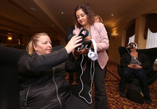 JASON HALSTEAD / WINNIPEG FREE PRESS

L-R: Becky Bonertz (left) tries out EMD Serono's virtual-reality 'MS Inside Out' simulator with help from Smita Devane-Bhan of EMD Serono at the Multiple Sclerosis Society of Canada - Manitoba Division's Women Against Multiple Sclerosis (WAMS) inaugural gala luncheon at the Fort Garry Hotel on Oct. 11, 2018. (See Social Page)