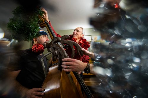 MIKAELA MACKENZIE / WINNIPEG FREE PRESS
Gilles Fournier (left) and Al Simmons try decorating Al and the bass while rehearsing for a concert series at the West End Cultural Centre in Winnipeg on Wednesday, Dec. 5, 2018.
Winnipeg Free Press 2018.