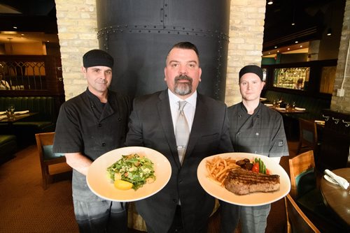 Mike Sudoma / Winnipeg Free Press
Chefs Paul Blawat (right), Scott Andrus (left) and General Manager, Laurent Chapdelaine (centre) show off some freshly prepared meals at The Keg downtown on Garry St Wednesday afternoon.
December 5, 2018