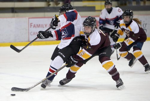 JASON HALSTEAD / WINNIPEG FREE PRESS

Portage Collegiate Institute Saints defenceman Emma Mooney (6) makes a timely stick check on St. Mary's Flames forward Maia Ehmann during CTV Division 1 Winnipeg Women's High School Hockey League action on Dec. 5, 2018 at the Bell MTS Iceplex.