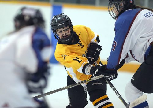 JASON HALSTEAD / WINNIPEG FREE PRESS

Lorette Scorpions defenceman Chloe Gauthier gets a shot away under pressure from College Sturgeon Heights Collegiate Huskies Julia Petit during Winnipeg Free Press Division 2 Winnipeg Women's High School Hockey League action on Dec. 5, 2018 at the St. James Civic Centre.