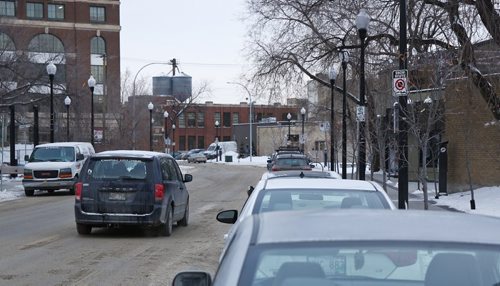 MIKE DEAL / WINNIPEG FREE PRESS
Cars parked on Lily Street. The city was towing cars last night along Rupert and Lily while people were at the MTC Warehouse theatre.
181206 - Thursday December 6, 2018