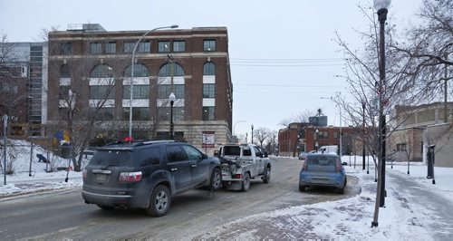 MIKE DEAL / WINNIPEG FREE PRESS
Cars parked on Lily Street. The city was towing cars last night along Rupert and Lily while people were at the MTC Warehouse theatre.
181206 - Thursday December 6, 2018