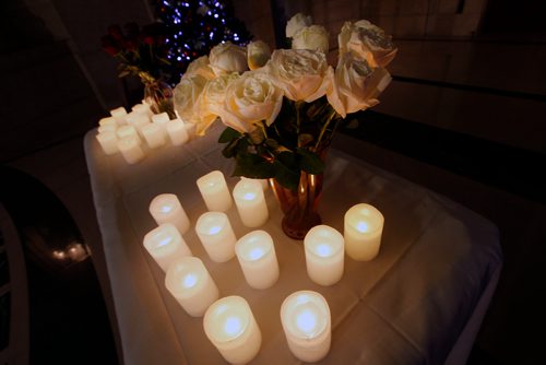 PHIL HOSSACK / WINNIPEG FREE PRESS - A dozen roses and a dozen candles to mark each of the murdered women in Manitoba this year as aproximately 100 people gathered at the legislature's rotunda  Thursday eveniong to mark the National Day of Remembrance and Action on Violence Against Women. - December 5, 2018