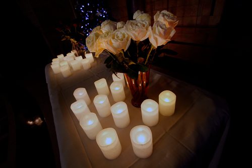 PHIL HOSSACK / WINNIPEG FREE PRESS - A dozen roses and a dozen candles to mark each of the murdered women in Manitoba this year as aproximately 100 people gathered at the legislature's rotunda  Thursday eveniong to mark the National Day of Remembrance and Action on Violence Against Women. - December 5, 2018