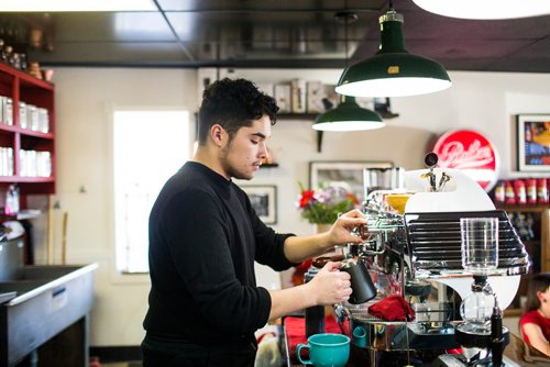 MIKAELA MACKENZIE / WINNIPEG FREE PRESS
Quinton Delorme, barista at Modern Coffee, makes drinks at the newly opened cafe at Inkster and Main in Winnipeg on Friday, Dec. 7, 2018.
Winnipeg Free Press 2018.