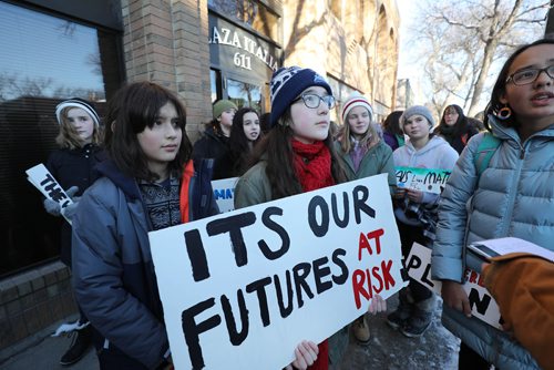RUTH BONNEVILLE / WINNIPEG FREE PRESS


Madison Delaat (glasses, red scarf), holds sign in the front row with her fellow classmates from Ecole River Heights School outside Winnipeg South Centre, (Liberal) MP Jim Carr's constituency office lobbying the government for laws to protect the planet on Friday.  

See story.

 Dec 7th, 2018