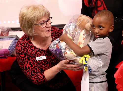 RUTH BONNEVILLE / WINNIPEG FREE PRESS

Marilyn Anderson Corkum (board member with Welcome Place) hands Manzi Tibert (4yrs, boy), a package that includes a bear at the launch on Monday.  

Manitoba Interfaith Immigration Council (Welcome Place) hold their official Launch of Doll and Teddy Bear Program for Refugee Children at Welcome Place on Monday. 
The program is a combined effort with our American friends from Dont Cry which hands out welcome packages that include dolls and teddy bears for the children dressed in cultural appropriate clothing given to refugee children upon their arrival to Canada at Welcome Place. 





Dec 10th, 2018