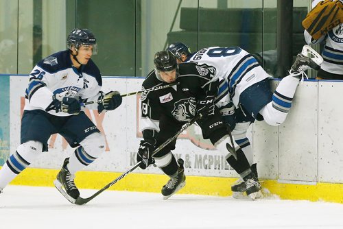 JOHN WOODS / WINNIPEG FREE PRESS
Steinbach Pistons' Brendan Westbrook (8) is checked by Neepawa Natives' Braden Gillies (19) at Seven Oaks Sportsplex Monday, December 10, 2018.